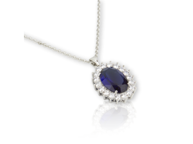 Oval Pendant set with Clear Crystals and a big Royal Blue Crystal