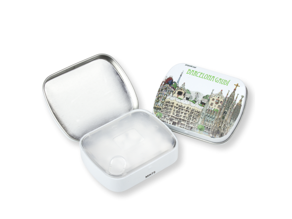 Two tin boxes of mints, one open, the other illustrated with Gaudí's monuments in Barcelona