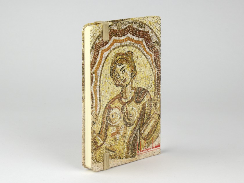 notebook seen from the front with a cover showing a reproduction of the Dotô mosaic