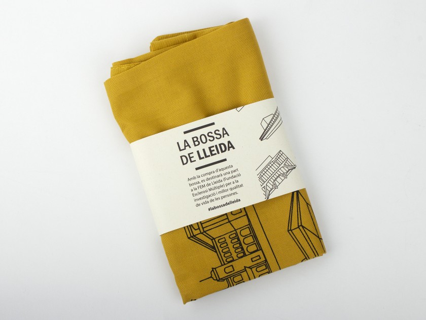 mustard coloured tote bag with several symbols of the city of Lleida printed on it