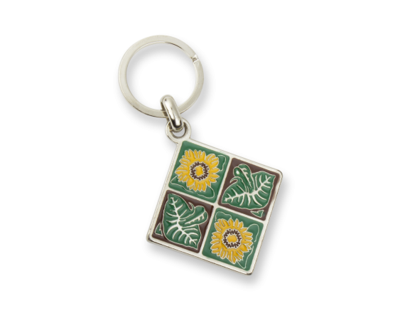metal keyring showing flowers and sunflower leaves