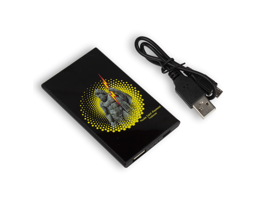 black power bank with a drawing of a Jupiter with lightning printed on it, and its cord placed next to it