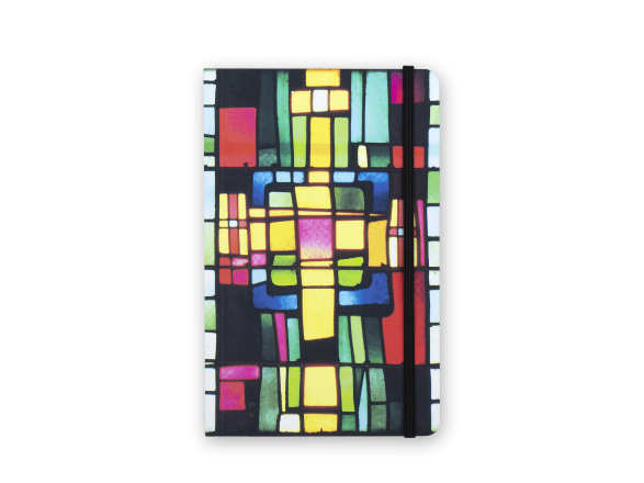 notebook seen from the front with a cover printed with coloured stained glass