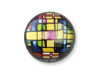 glass paperweight seen from above with a stained glass window inside