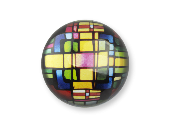 glass paperweight seen from above with a stained glass window inside