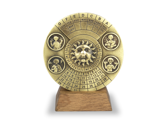 Perpetual calendar in gilded metal on a wooden base