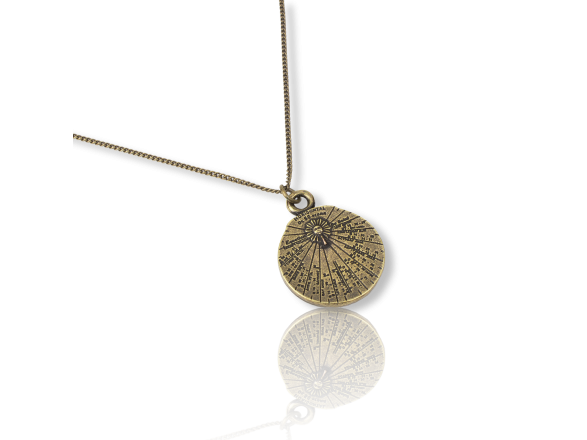small brass sundial-shaped pendant