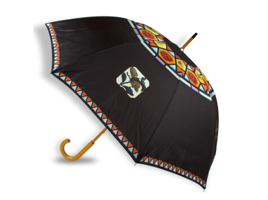 open umbrella with designs of stained glass windows printed on it