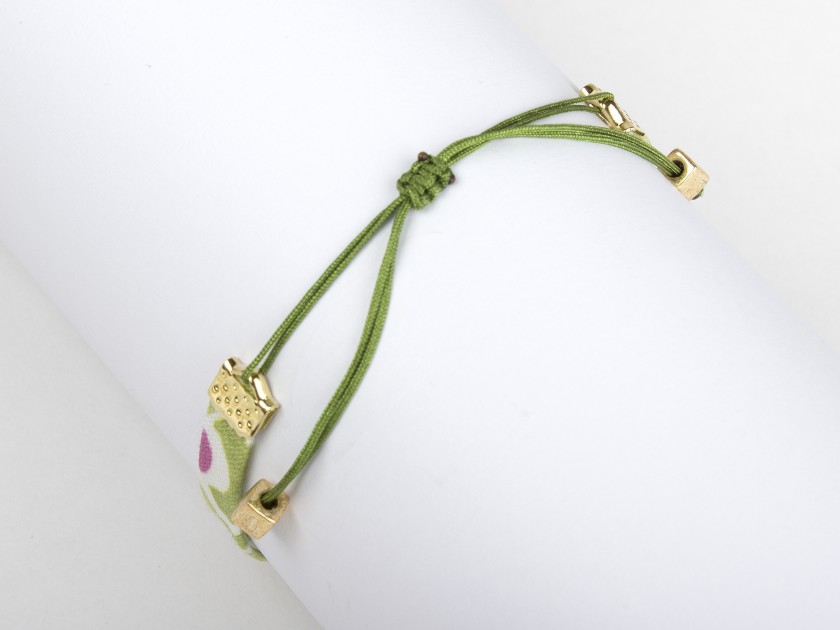green flowery fabric bracelet with a sewn-on golden bee