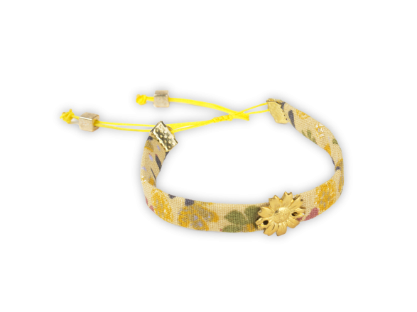 mustard coloured fabric bracelet with a golden sunflower sewn in