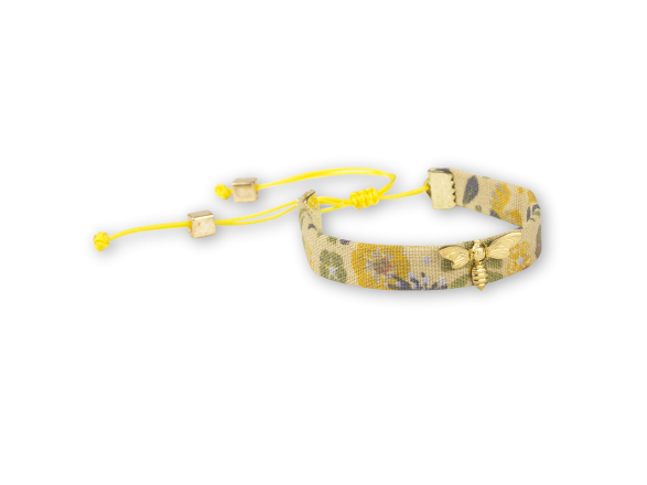 floral fabric bracelet in mustard tones with a sewn-on golden bee