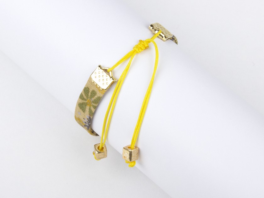 floral fabric bracelet in mustard tones with a sewn-on golden bee