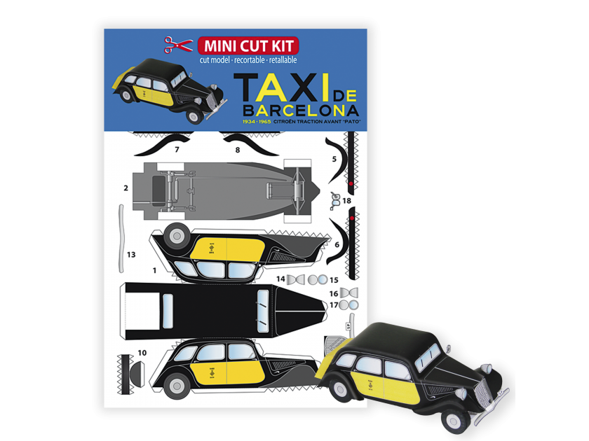 model of a Barcelona taxi in front of its packaging made up of the pieces to assemble the model