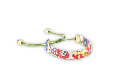 fabric bracelet with floral motifs and a golden bee sewn on