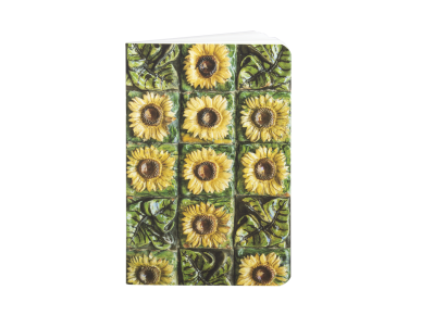 cover of a notebook with an illustration showing the sunflower-shaped ceramic tiles of El Capricho de Gaudí