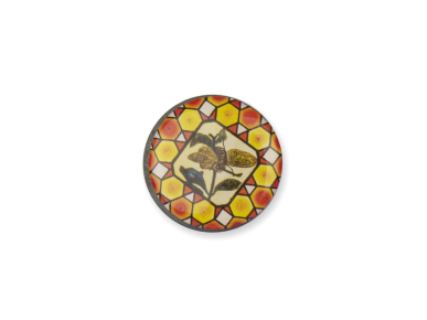 round magnet with a picture of a stained glass window with a bee playing the guitar