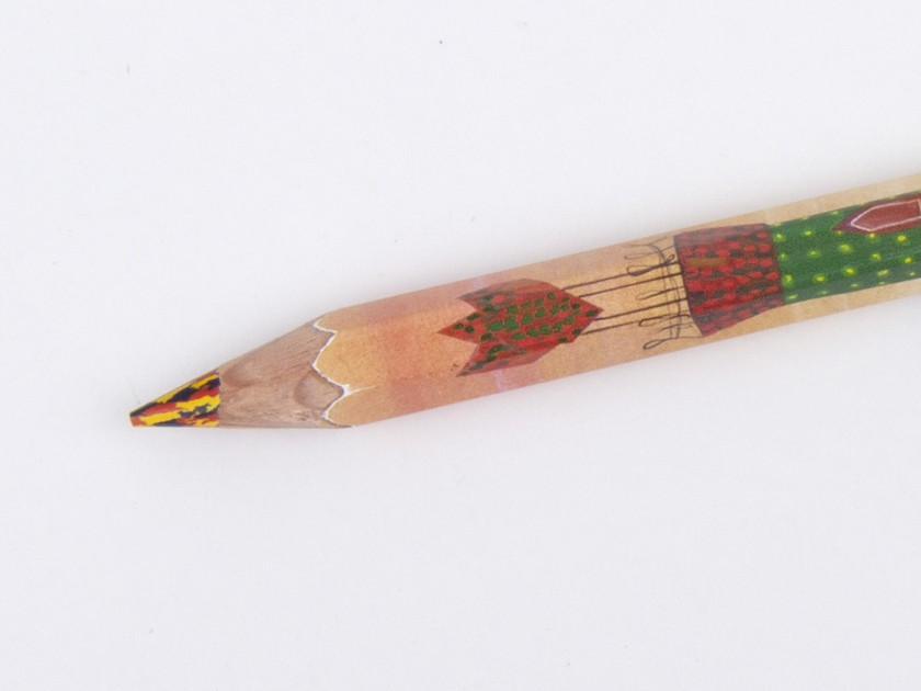 crayon avec une mine multi-couleurs et un dessin de la tour du Capricho de Gaudí