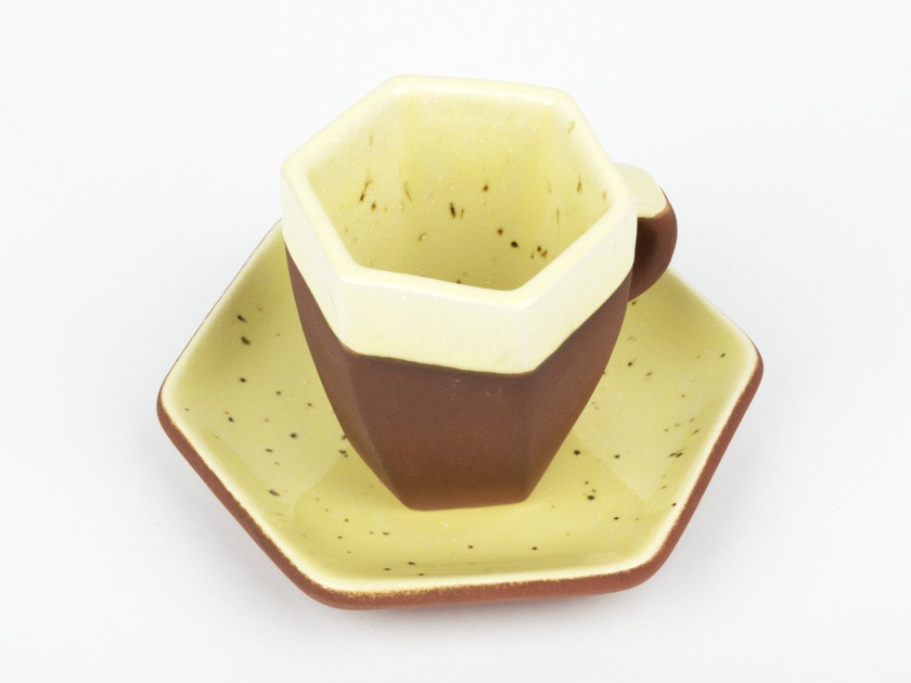 yellow enamelled coffee cup and saucer