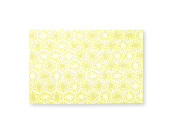 estovalles individual groc amb motius hexagonals impresos
