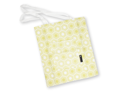 bossa de roba groga amb motius hexagonals impresos