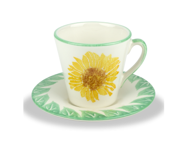taza y platillo de café esmaltados y decorados con una flor y hojas de girasol