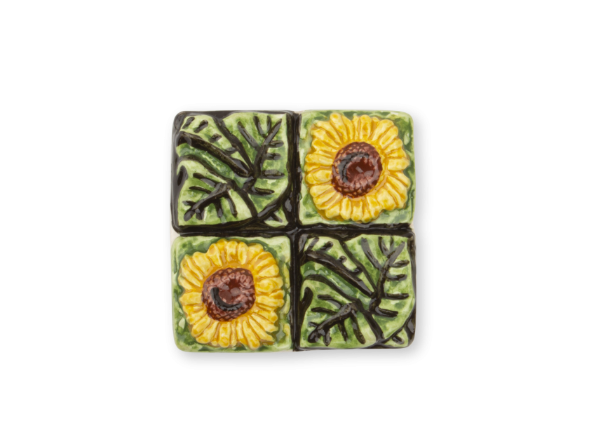 glazed ceramic magnet featuring flowers and sunflower leaves