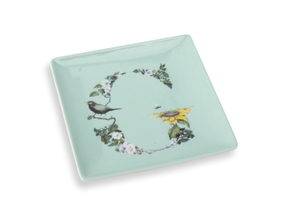 small watermint coloured ceramic tray with an illustration of the initial G printed on it