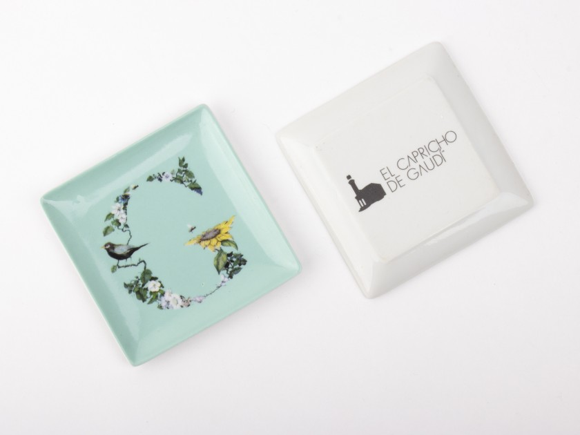 small watermint coloured ceramic tray with an illustration of the initial G printed on it