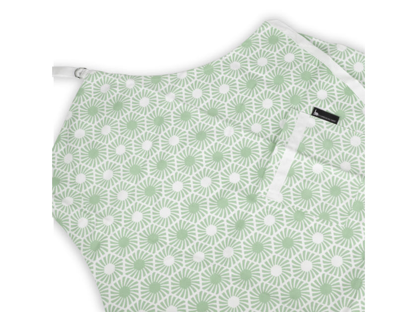 green apron with printed hexagonal patterns