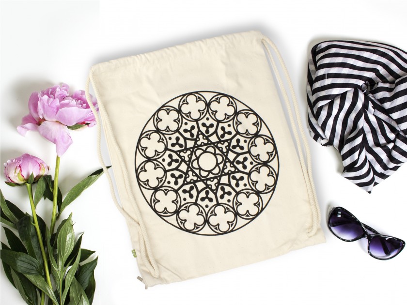 natural fabric backpack with drawstring closure, with a black printed rose window