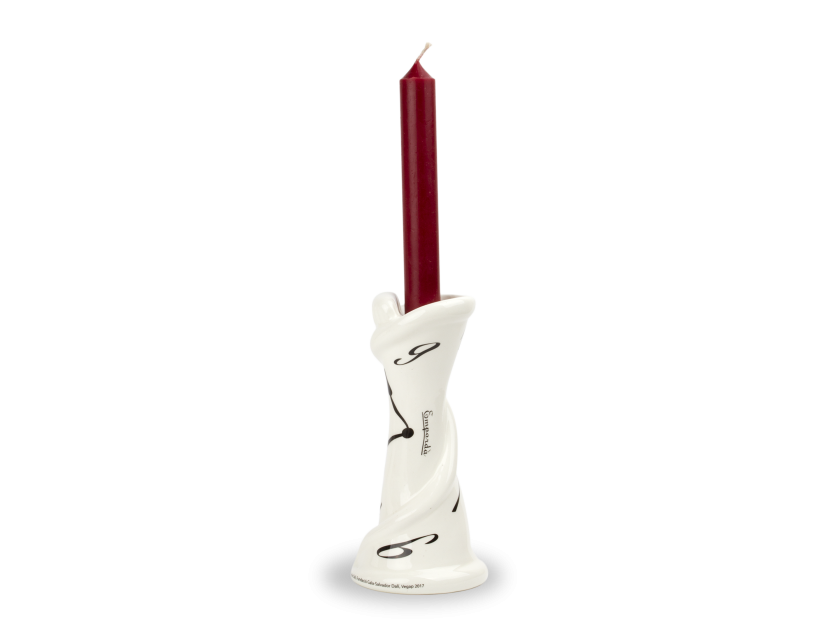 Black and white enamelled ceramic candlestick with a candle