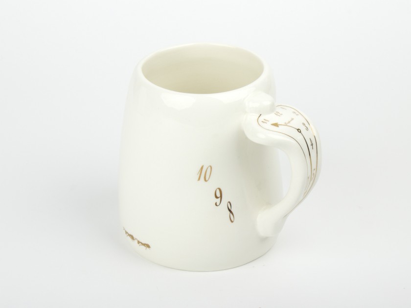 Large white and gold glazed ceramic mug