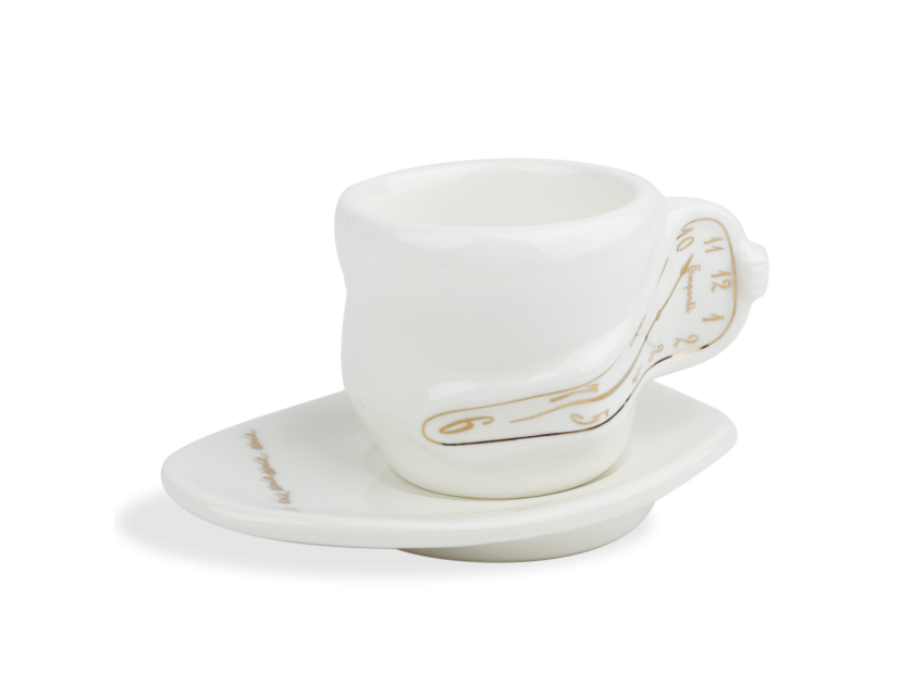 White and gold glazed ceramic coffee cup and saucer